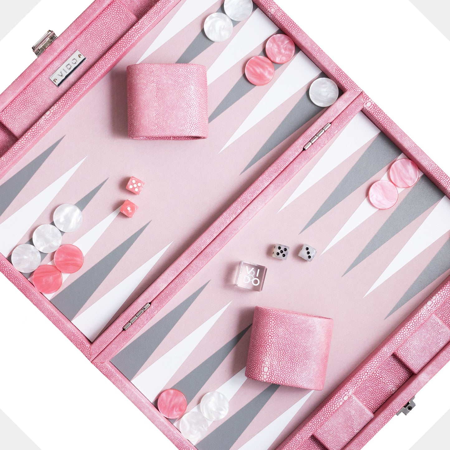 Pink backgammon set with pieces and dice on a white background by VIDO