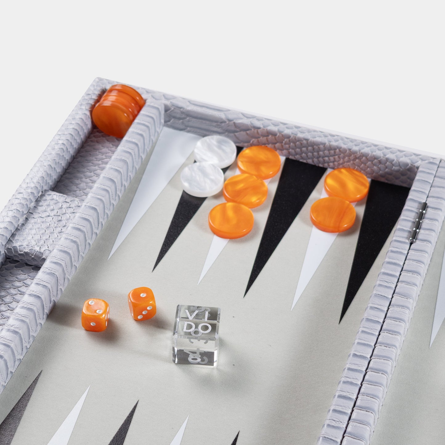 Backgammon board grey with orange and white pieces on a light gray background by VIDO